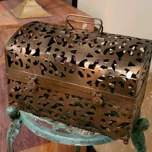 Chest.  Rustic metallic metal cutout